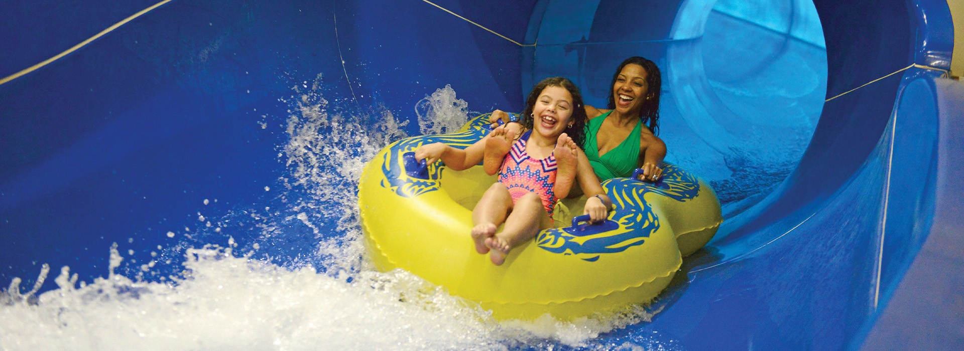 A family enjoys the water rides and other things to do at Great Wolf Lodge Water Park.