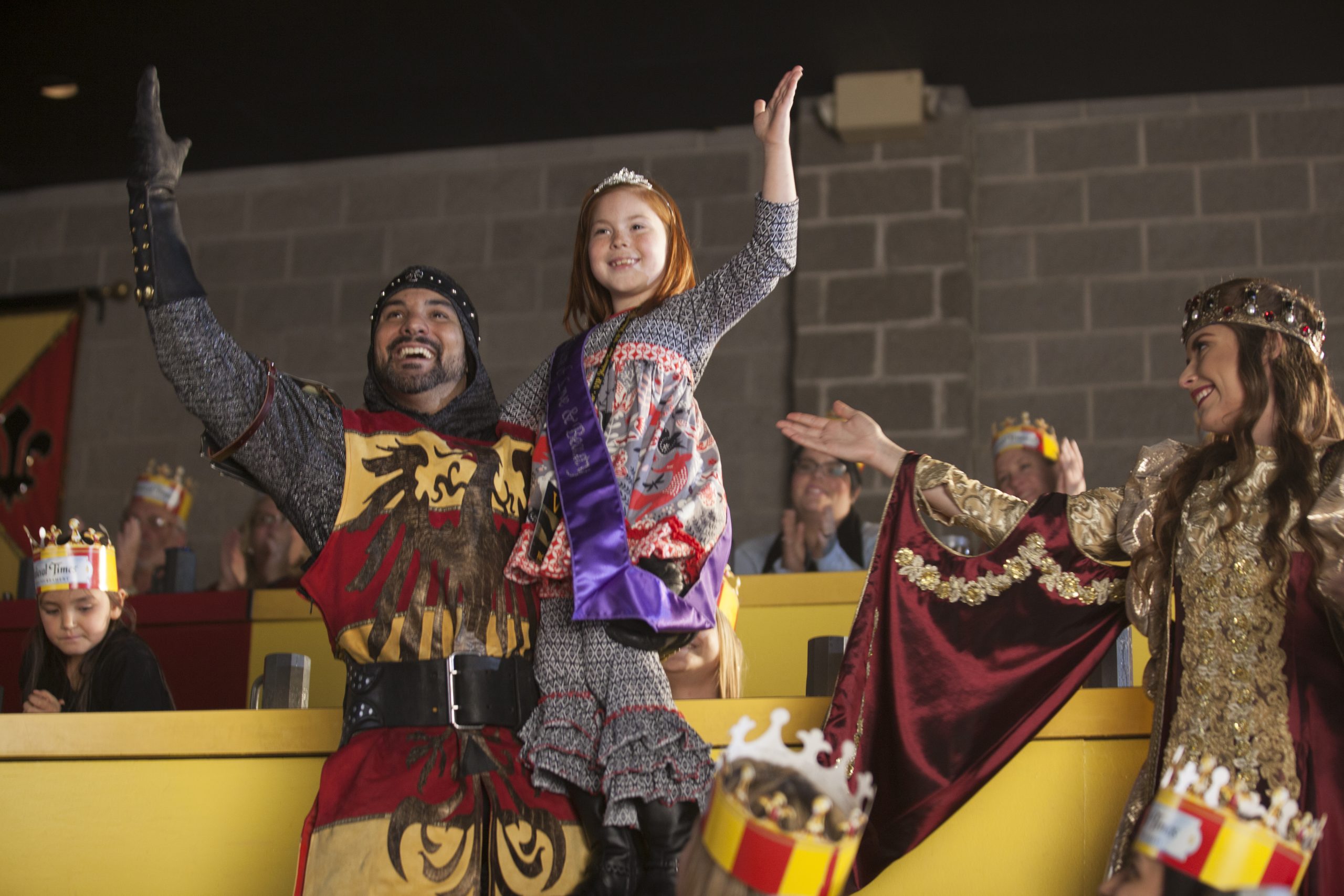 A small girl wins a contest at Medieval Times, a popular thing to do for families around Salt River.